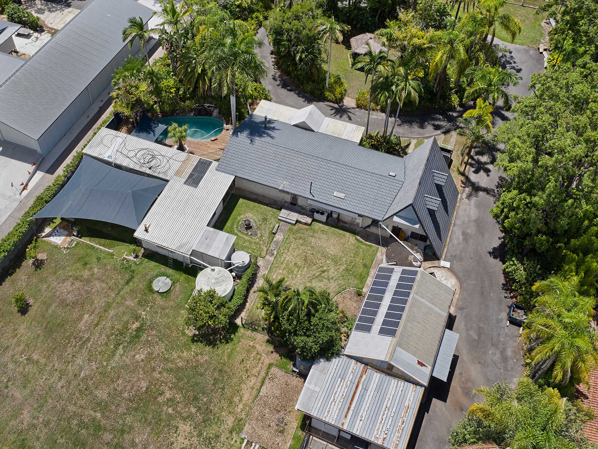  Sneaking  in between the palm trees at 4m above the ground to capture the front of 357 Manly Rd