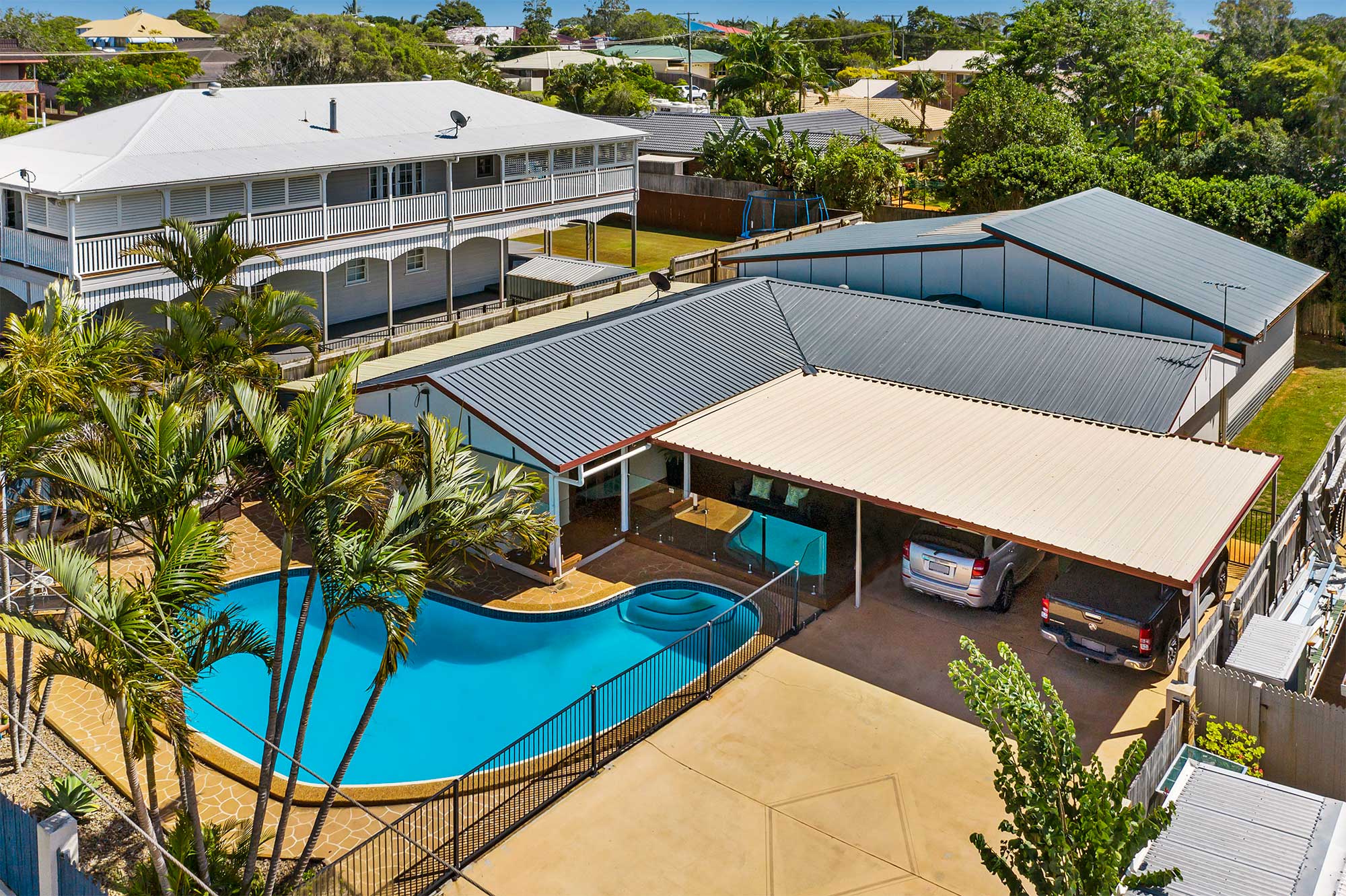 Drone photography of home for sale at Victoria Point highlighting the swimming pool area