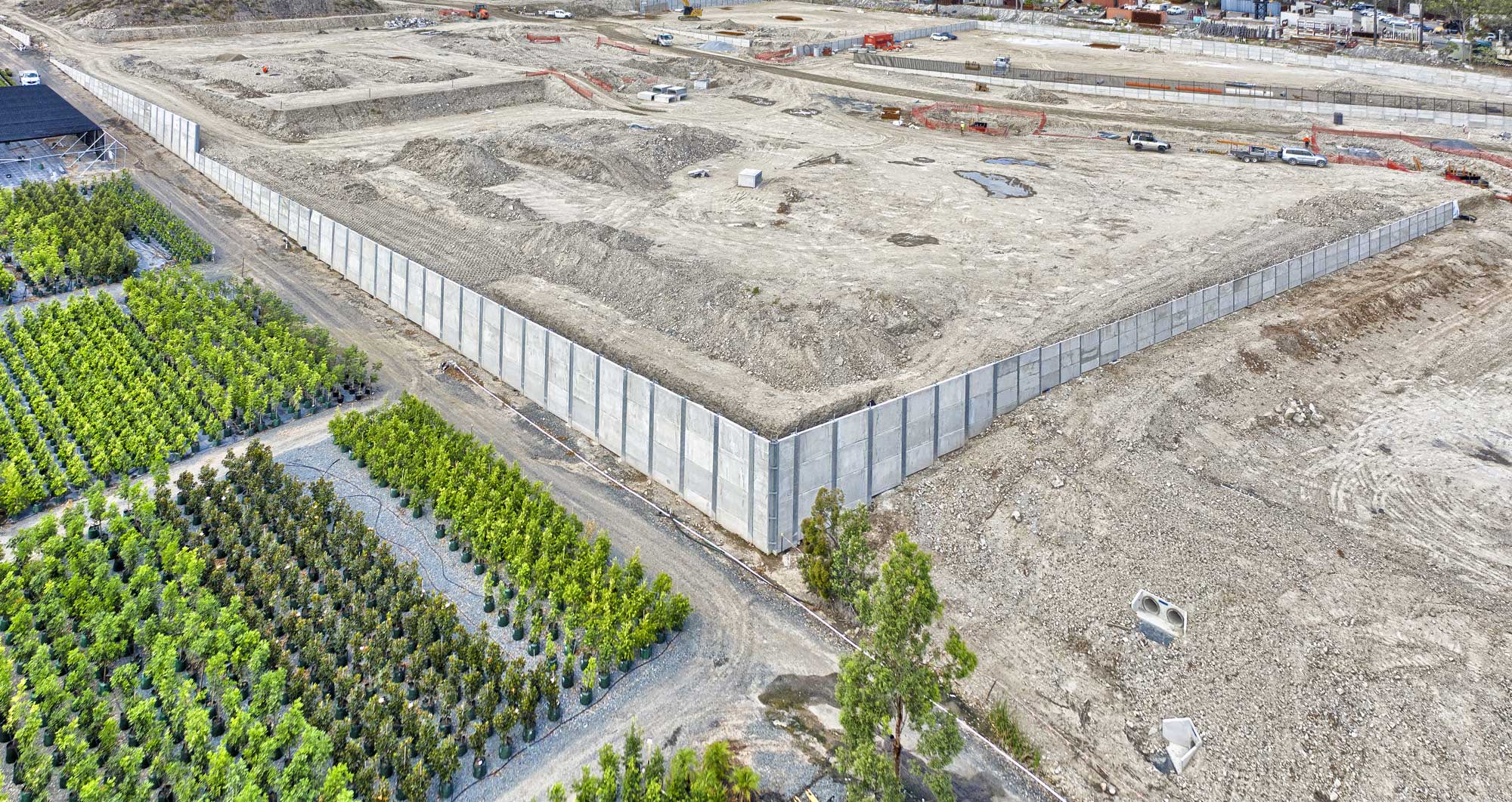 Drone photography of Concrib retaining wall under construction at Yatala Drone photography of Concrib retaining wall under construction at Yatala