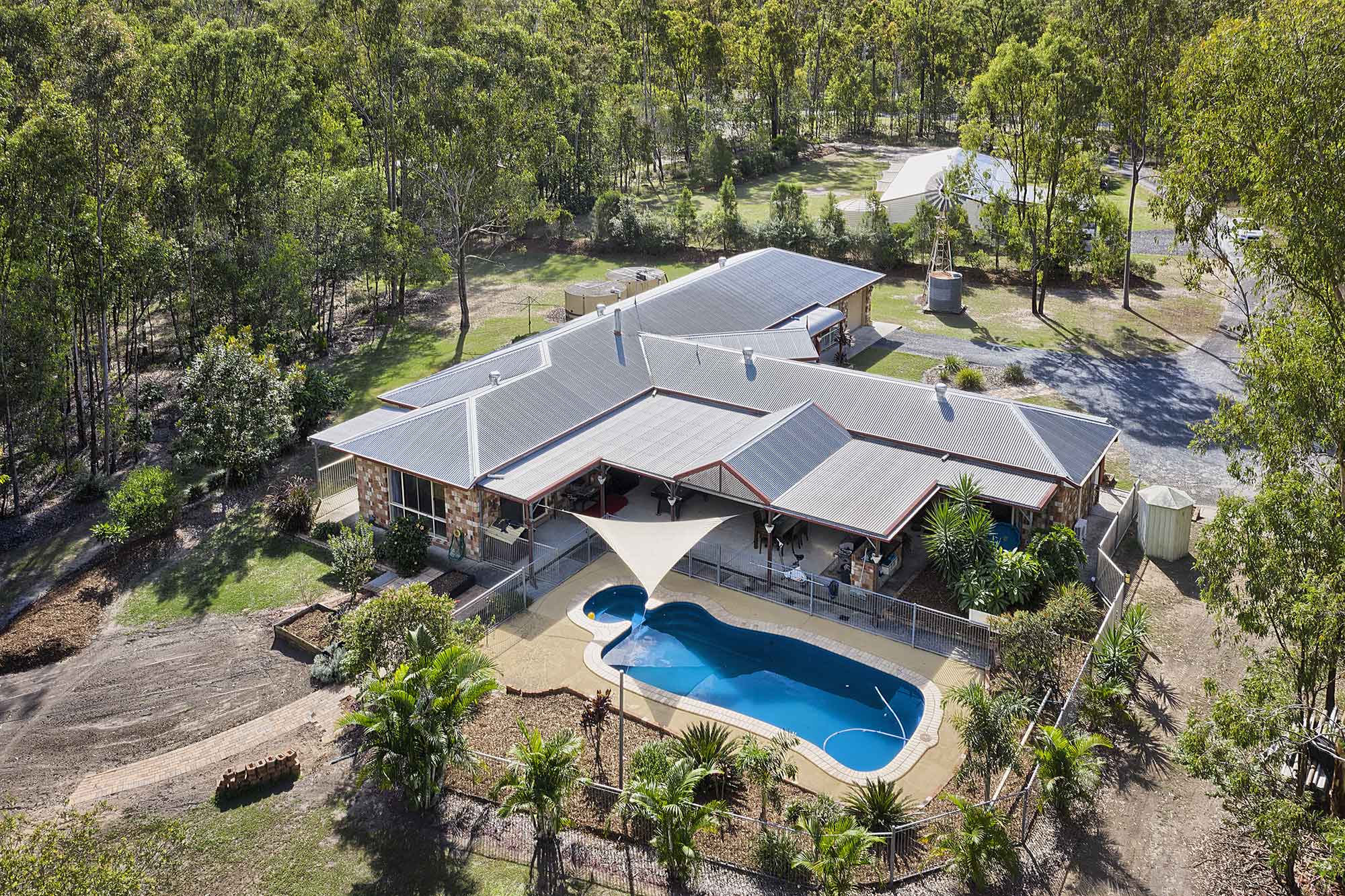 Drone photography of the pool - acreage property for sale at 56 Sandpiper St Jimboomba