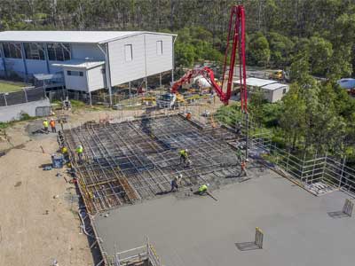 Drones in construction - photography for INTREC Management concrete slab pour at Augusta State School