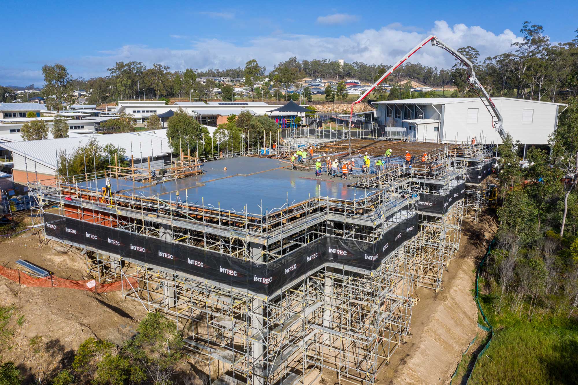 The second stage of the INTREC Management concrete slab pour underway at the Augusta State School, Queensland