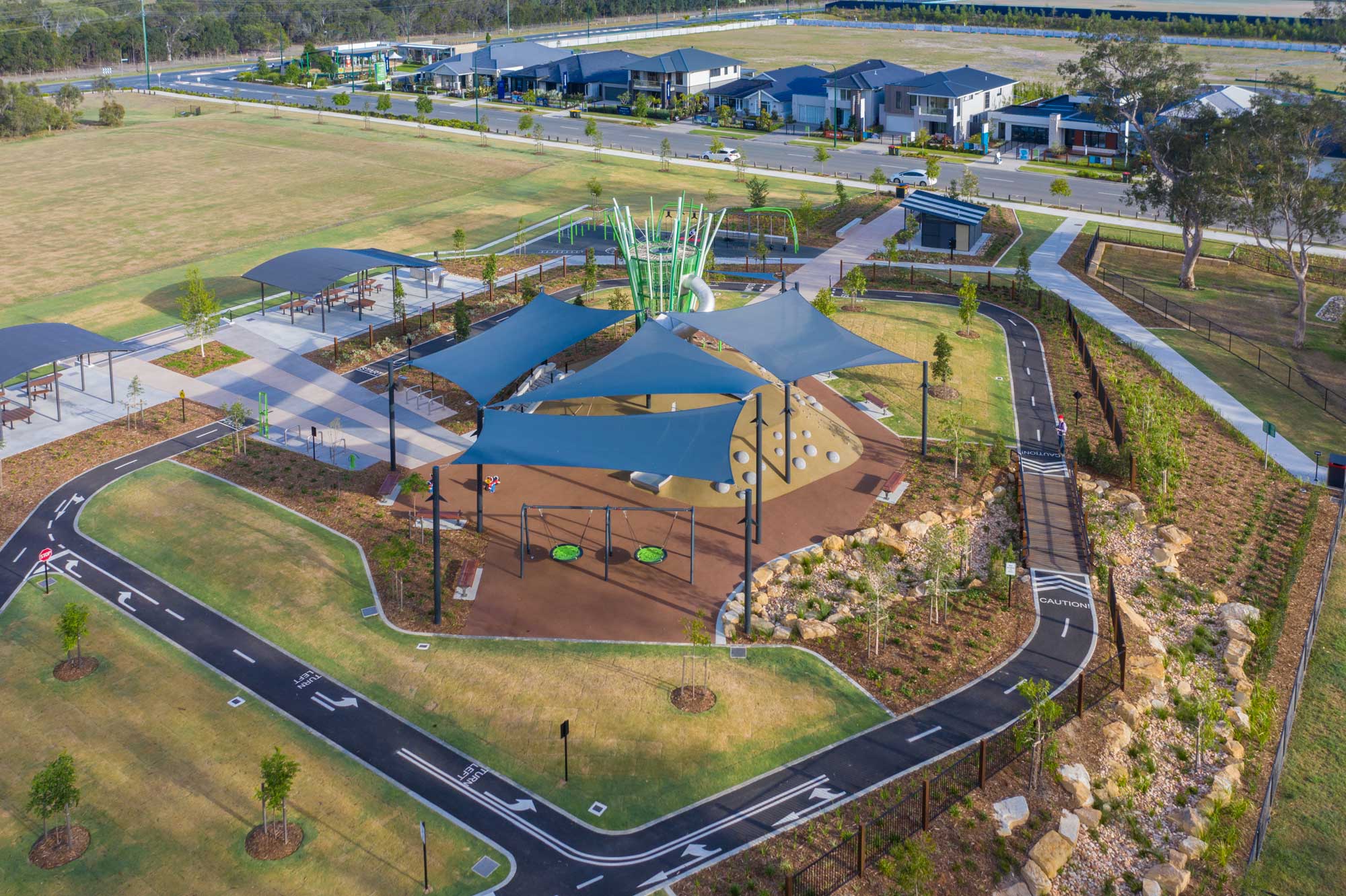  Drone photograph of a large shade structure over a Brisbane council park.