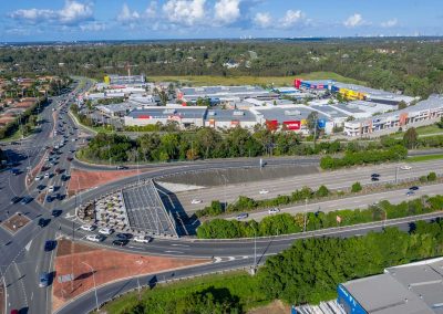 Drone video of the Homeworld Helensvale shopping centre flying along side the M1 motorway